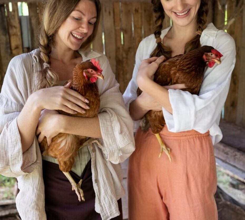 front-view-smiley-women-holding-chickens_23-2149456973 (1)